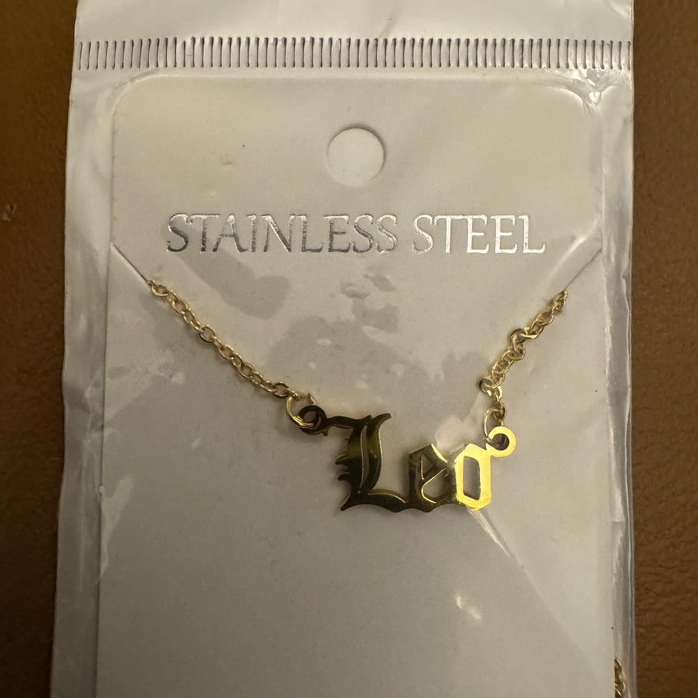 Gold Plated/Stainless Steel Leo Script Pendant Necklace